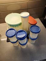 Group shot of all Tupperware pieces and booklet