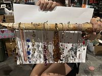 Full group of necklaces hanging from rod