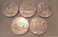 Obverse canoe design on all five coins showing dates 1975, 1978, 1978, 1980 and Constitution 1982 reverse