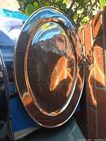 Front view of a stainless steel oval tray