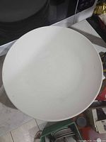 Top view of a single white ceramic dinner plate