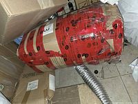 Rolled topper in red and cardboard packaging