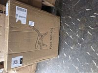 sealed shipping carton showing line drawing of beach chair