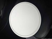 Front view showing white round LED light with smooth lens