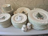 Stacks of plates, bowls, large platter, salt & pepper shakers
