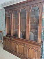 Front view of full china cabinet hutch showing upper glass doors and lower wood doors