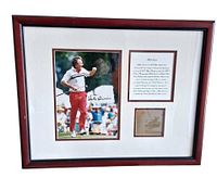 Full view of framed photograph, text panel, and plaque