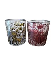 Front view of both Waldglas tumblers showing color and medieval scenes
