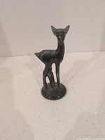 Full view of deer figurine on base