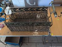 Top view of entire basket showing wicker body, metal frame and handles