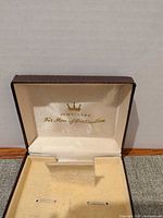 Open jewellery case interior showing branding