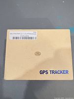Beige box top view with GPS Tracker label