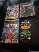 All five GameCube games displayed: three boxed titles and two loose discs