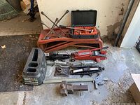 Group view of all items including jacks, ramps, hitch, lug wrenches and traction boards