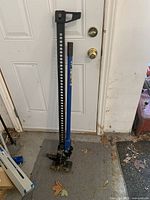 Full view of 48-inch farm jack leaning against door