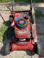 Top-down view of Craftsman mower showing Honda 5.5 hp engine cover, deck and wheels