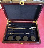Open wooden box showing entire set layout