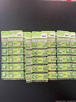 Front view of multiple green blister cards showing rows of CR927 lithium batteries