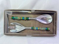 Boxed set showing spoon and fork with beaded handles