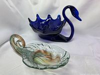 Cobalt blue swan bowl and clear swirl bowl side by side