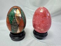 Front view of both eggs on stands