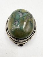 Front view showing oval green jasper cabochon in silver bezel