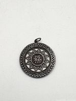 front view showing Chinese character 福 and pierced design