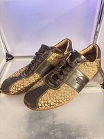 Pair of Coach Sylvie sneakers side view showing overall design