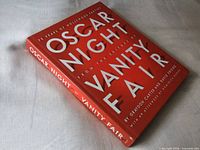 Front view of red dust-jacketed hardcover "Oscar Night" book