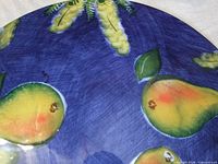Close-up of pear and leaves on blue background