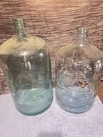 Both glass carboys front view