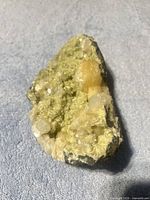 Overall view of specimen showing peach/orange stilbite crystals on green prehnite matrix