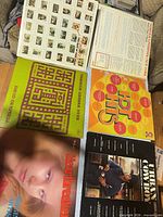 Five vinyl LPs laid out showing covers and back of John Prine