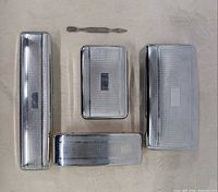 Five chromium-plated items laid out showing sizes