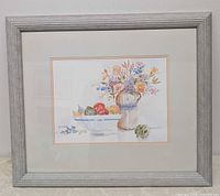 Full view of framed painting showing artwork, matting, and grey frame