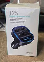 Front of retail box showing Lencent T25 Bluetooth FM transmitter image and features