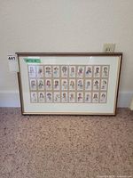 Full view of framed card display against wall