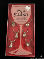 Front view of boxed six-piece wine marker set