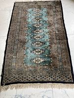 Full view of rug showing pattern and colors