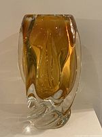 front view of sculptural amber and clear vase