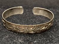 Side view of sterling silver engraved cuff bracelet