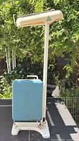 Overall view showing full scale, blue platform, cream head