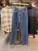 Front view of blue Mindset jeans hanging