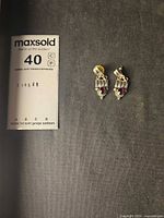 Front view of sterling silver garnet drop earrings