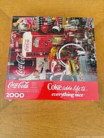 Front view of sealed Coca-Cola 2000-piece puzzle box