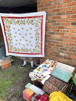 Full view of printed cotton floral tablecloth held up