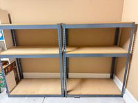 Front view of two-bay steel shelving showing all shelves