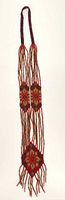 Full view of entire beaded necklace showing length, pattern and fringe