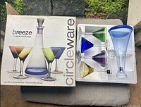 Box showing Circleware Breeze 5-piece cordial set and opened foam insert with contents