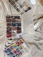 overview of two open organiser boxes showing assorted wood and resin beads plus metal findings